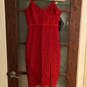 Brand new LuLus lace dress. Knee length with slit.